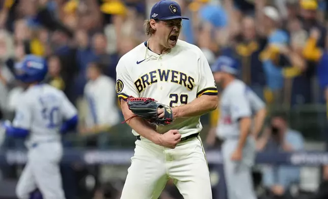 Milwaukee Brewers pitcher Trevor Megill celebrates after Game 1 of baseball's National League Championship Series between the Milwaukee Brewers and the Los Angeles Dodgers, Sunday, Oct. 11, 2026, in Milwaukee. (AP Photo/Abbie Parr)