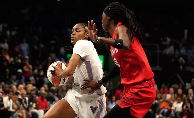 Golden State Valkyries' Tiffany Hayes, left, goes up to shoot against Atlanta Dream's Rhyne Howard during the first half of Game 6 of the WNBA basketball finals on Thursday, Oct. 29, 2026, in Atlanta. (AP Photo/Brynn Anderson)