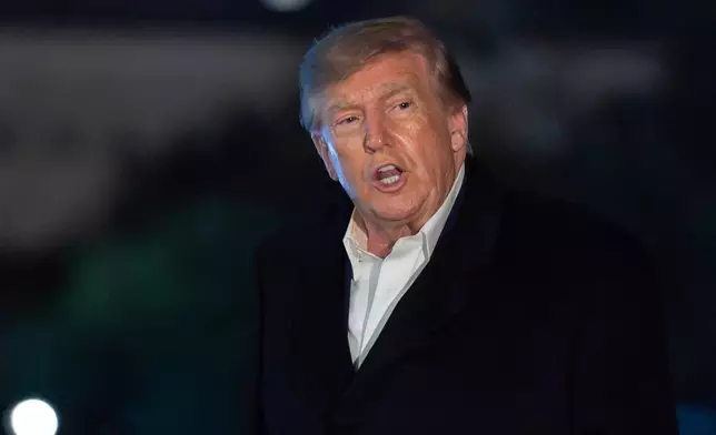 President Donald Trump talks to reporters as he walks on the South Lawn upon his arrival to the White House, Tuesday, Oct. 20, 2026, in Washington. (AP Photo/Jose Luis Magana)
