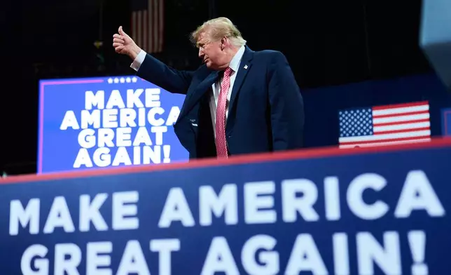 President Donald Trump gives a thumbs up after speaking during a campaign rally at Heartland Credit Union Arena, Monday, Oct. 19, 2026, in Park City, Kan. (AP Photo/Julia Demaree Nikhinson)
