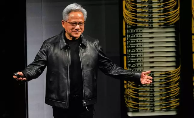 Nvidia CEO Jensen Huang delivers his keynote on the company's GTC event in Berlin, Germany, Wednesday, Oct. 21, 2026. (AP Photo/Markus Schreiber)