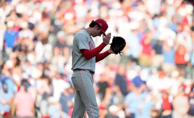 Philadelphia Phillies pitcher Andrew Painter celebrates the final out against the Atlanta Braves in the 10th inning during Game 2 of baseball's National League Wild Card Series Wednesday, Sept. 30, 2026, in Atlanta. (AP Photo/Brynn Anderson)