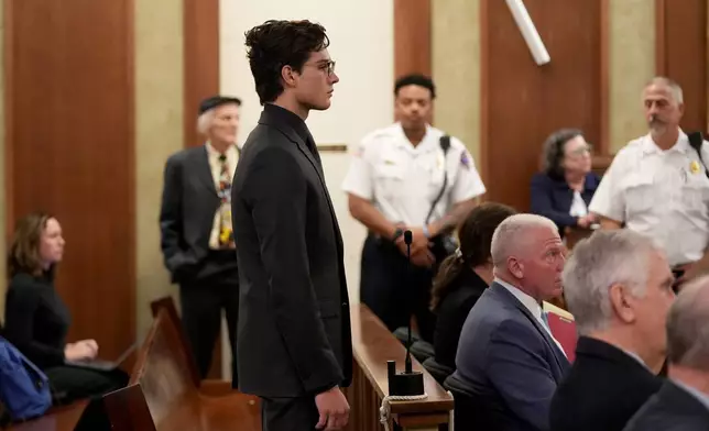 Braden Peters, also known as Clavicular, stands at the microphone during his arraignment in Orleans District Court, Thursday, Oct. 22, 2026, in Orleans, Mass. (Merrily Cassidy/Cape Cod Times via AP, Pool)