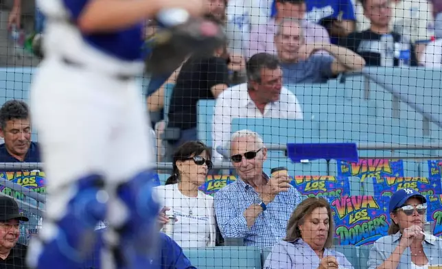 Former Los Angeles Dodgers pitcher Sandy Koufax, center, looks on during the second inning of Game 2 of a National League Division Series baseball game against the Atlanta Braves Sunday, Oct. 4, 2026, in Los Angeles. (AP Photo/Mark J. Terrill)