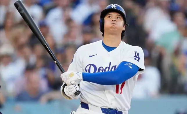 Los Angeles Dodgers' Shohei Ohtani exhales while batting during the third inning of Game 2 of a National League Division Series baseball game against the Atlanta Braves Sunday, Oct. 4, 2026, in Los Angeles. (AP Photo/Mark J. Terrill)
