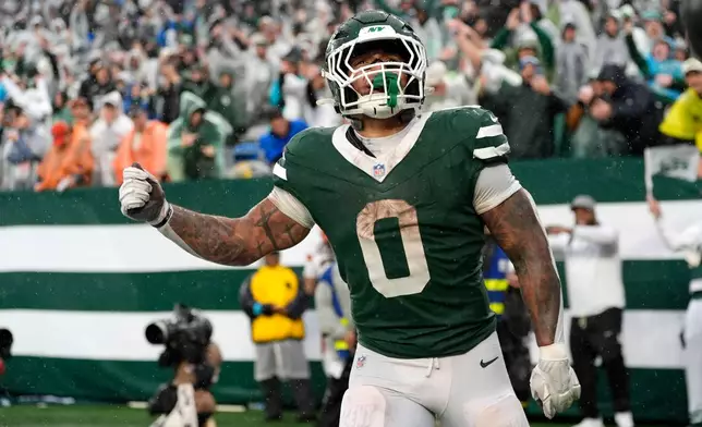 New York Jets running back Braelon Allen celebrates after a touchdown run during the second half of an NFL football game against the Cleveland Browns, Sunday, Oct. 11, 2026, in East Rutherford, N.J. (AP Photo/Seth Wenig)
