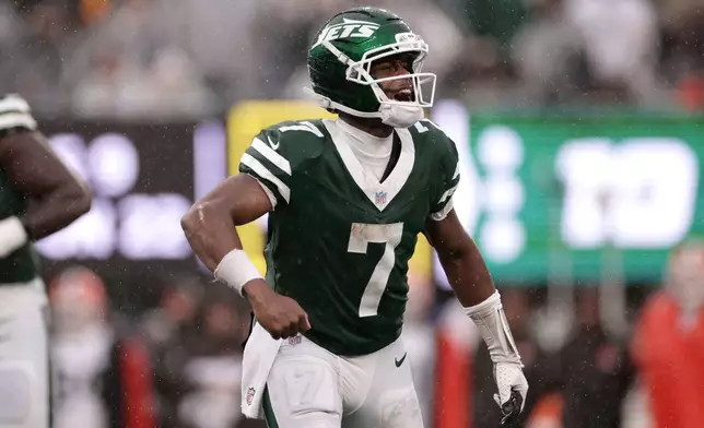 New York Jets quarterback Geno Smith (7) celebrates after a touchdown during the second half of an NFL football game against the Cleveland Browns, Sunday, Oct. 11, 2026, in East Rutherford, N.J. (AP Photo/Adam Hunger)