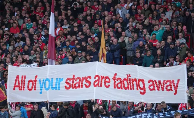 Fans display a banner as they cheer at the stand prior the English Premier League soccer match between Liverpool and Manchester City in Liverpool, England, Sunday, Oct. 11, 2026. (AP Photo/Jon Super)