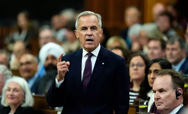 Canada Prime Minister Mark Carney rises during Question Period in the House of Commons on Parliament Hill in Ottawa on Monday, Oct. 5, 2026. (Justin Tang/The Canadian Press via AP)