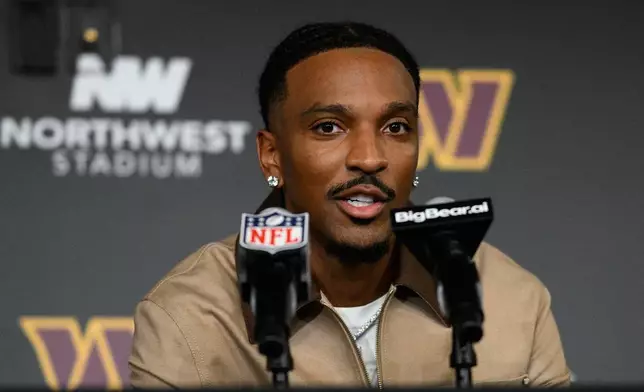 Washington Commanders quarterback Jayden Daniels speaks during a press conference after an NFL football game in Landover, Md., Sunday, Oct. 11, 2026. (AP Photo/Nick Wass)
