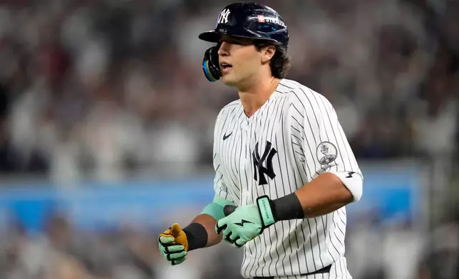 New York Yankees' Spencer Jones reacts after safely reaching first base on a wild pitch against the Boston Red Sox during the sixth inning in Game 2 of baseball's American League Wild Card Series, Wednesday, Sept. 30, 2026, in New York. (AP Photo/Yuki Iwamura)
