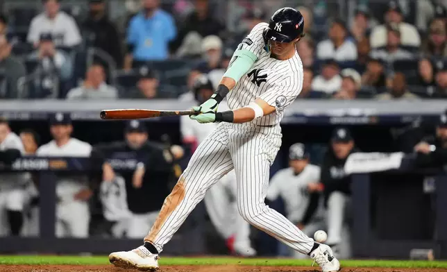 New York Yankees' Spencer Jones strikes out on a wild pitch by Boston Red Sox' Garrett Crochet during the sixth inning in Game 2 of baseball's American League Wild Card Series Wednesday, Sept. 30, 2026, in New York. (AP Photo/Frank Franklin II)