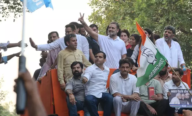 India's opposition Congress party leader Rahul Gandhi, center, and his sister, fellow lawmaker Priyanka Gandhi Vadra, lead opposition party leaders and workers in a march toward the Supreme Court demanding the resignation of Chief Election Commissioner Gyanesh Kumar in New Delhi, India, Monday, Oct. 12, 2026. (AP Photo)