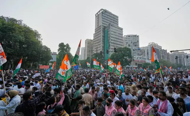 Workers and activists of various opposition parties march toward the Supreme Court demanding the resignation of Chief Election Commissioner Gyanesh Kumar in New Delhi, India, Monday, Oct. 12, 2026.(AP Photo/Manish Swarup)