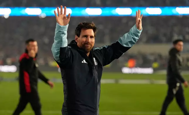 Argentina's Lionel Messi waves to fans at the end of an international friendly soccer match against Benin, marking his farewell appearance for the national team, in Buenos Aires, Argentina, Tuesday, Oct.6, 2026. (AP Photo/Gustavo Garello)