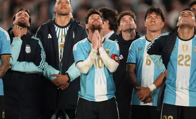 Argentina's Lionel Messi and teammates watch a drone show at the end of his final match for the national team, a soccer friendly against Benin, in Buenos Aires, Argentina, Tuesday, Oct.6, 2026. (AP/Photo/Gustavo Garello)