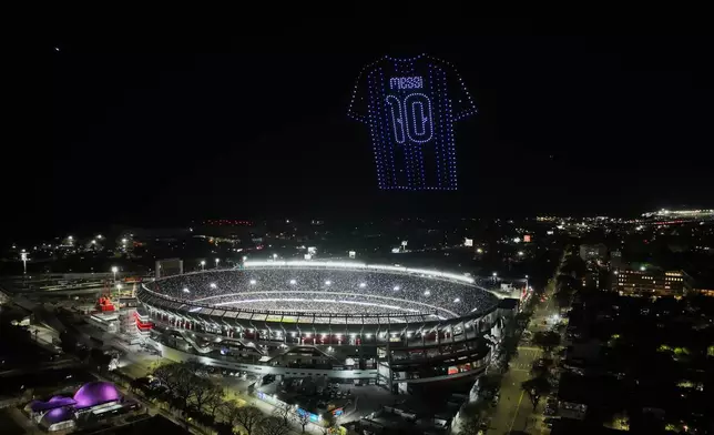 A drone display featuring Argentina's Lionel Messi's jersey is seen at the end of his final match for the national team, a soccer friendly against Benin, in Buenos Aires, Argentina, Tuesday, Oct.6, 2026. (AP Photo/Julian Bongiovanni)