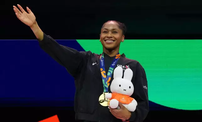Skye Blakely, of the United States, stands on the podium after winning the gold medal in the women's all-around final at the Artistic Gymnastics World Championships in Rotterdam, the Netherlands, Friday, Oct. 23, 2026. (AP Photo/Patrick Post)