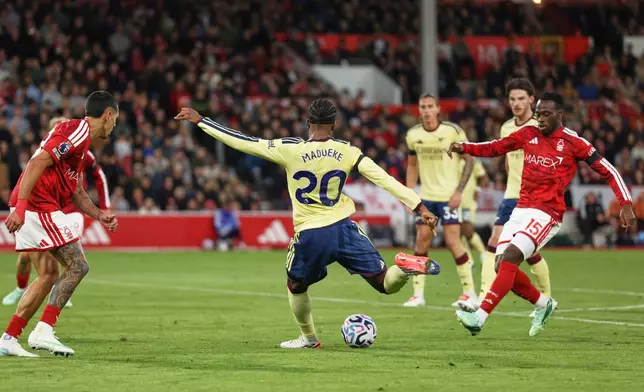 Arsenal's Noni Madueke scores his side's opening goal during the English Premier League soccer match between Nottingham Forest and Arsenal in Nottingham, England, Sunday, Oct. 18, 2026. (AP Photo/Maddy Grassy)