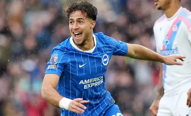 Brighton's Charalampos Kostoulas celebrates scoring their side's fourth goal during the English Premier League soccer match between Brighton and Hove Albion and Crystal Palace in Brighton, England, Sunday, Oct. 18, 2026. (Gareth Fuller/PA via AP)