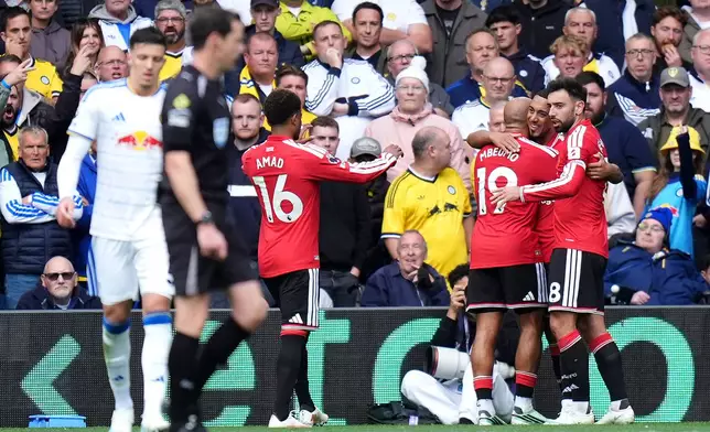 Manchester United's Bryan Mbeumo, third right, celebrates scoring during the English Premier League soccer match between Leeds United and Manchester United in Leeds, England, Sunday, Oct. 18, 2026. (Annabel Lee-Ellis/PA via AP)