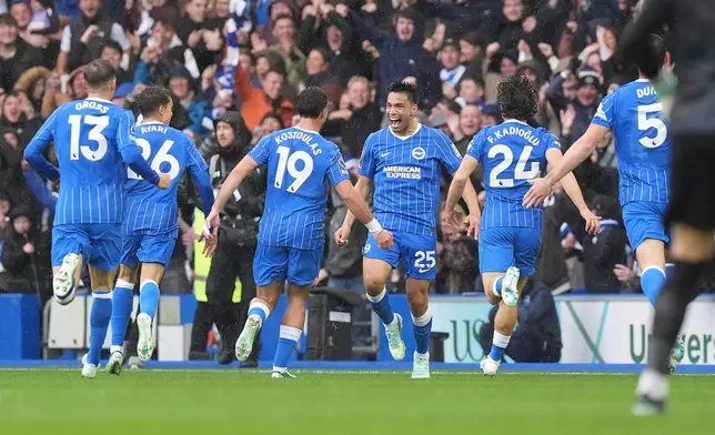 Brighton's Diego Gomez, center, celebrates scoring during the English Premier League soccer match between Brighton and Hove Albion and Crystal Palace in Brighton, England, Sunday, Oct. 18, 2026. (Gareth Fuller/PA via AP)