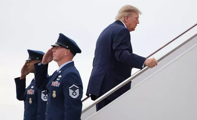 President Donald Trump boards Air Force One, Saturday, Oct. 3, 2026, at Joint Base Andrews, Md. (AP Photo/Mark Schiefelbein)