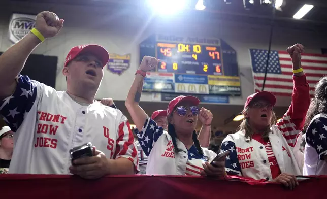 Supporters cheer before President Donald Trump arrives to speak at an event at Butler High School in Vandalia, Ohio, Saturday, Oct. 3, 2026. (AP Photo/Mark Schiefelbein)