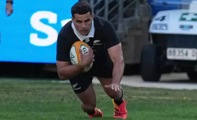 New Zealand's Josh Moorby scores a try against Australia during the Bledisloe Cup rugby union test in Sydney, Saturday, Oct. 17, 2026. (AP Photo/Mark Baker)