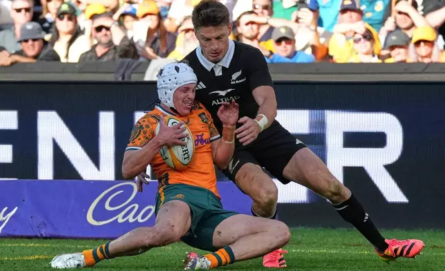 Australia's Declan Meredith, left, is tackled by New Zealand's Beaudern Barrett during the Bledisloe Cup rugby union test in Sydney, Saturday, Oct. 17, 2026. (AP Photo/Mark Baker)