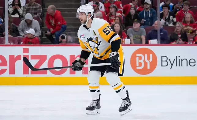 Pittsburgh Penguins defenseman Kris Letang (58) looks on during the second period of an NHL hockey game against the Chicago Blackhawks, Tuesday, Oct. 13, 2026, in Chicago. (AP Photo/Harry Figiel)