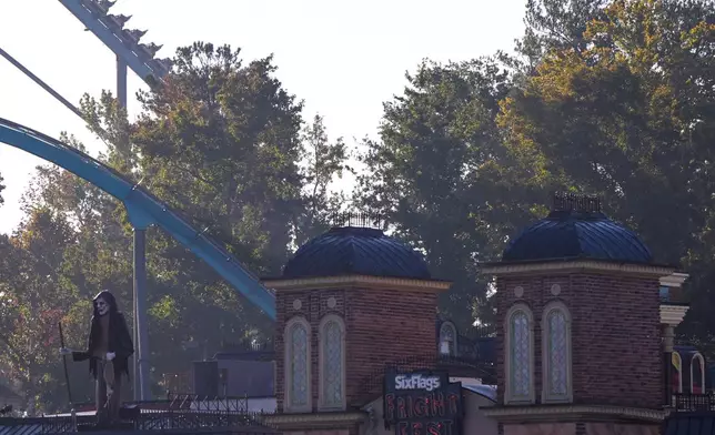 Attractions are seen at Six Flags Over Georgia, about 15 miles (24 kilometers) northwest of Atlanta, Tuesday, Oct. 13, 2026. (AP Photo/Mike Stewart)