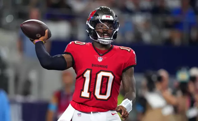 Tampa Bay Buccaneers quarterback Jalon Daniels passes against the Dallas Cowboys in the first half of an NFL football game in Arlington, Texas on Thursday, Oct. 8, 2026. (AP Photo/Julio Cortez)