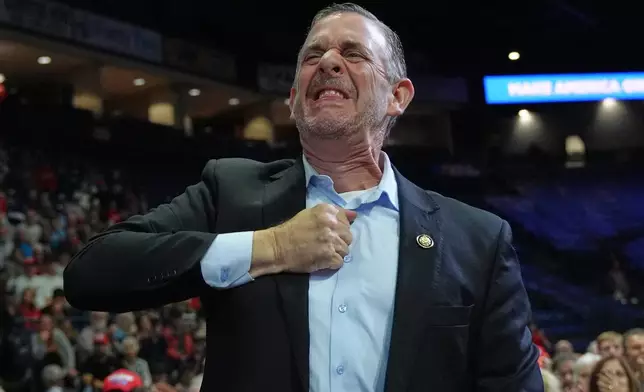 Rep. Michael Rulli, R-Ohio, gestures as President Donald Trump recognizes him at a campaign rally at the Covelli Centre, in Youngstown, Ohio, Monday, Oct. 12, 2026. (AP Photo/Jacquelyn Martin)