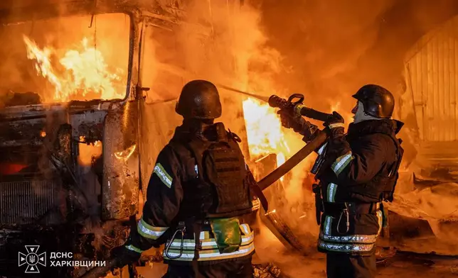 In this photo provided by the Ukrainian Emergency Service, firefighters put out a fire at the residential neighbourhood following a Russian air attack in Kharkiv, Ukraine, Thursday, Oct. 29, 2026. (Ukrainian Emergency Service via AP)