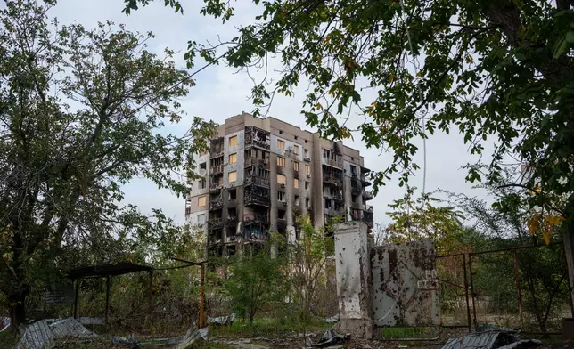 A residential building is seen damaged in Russian attacks during a local ceasefire related to a humanitarian aid mission in Oleshky, in Kherson, Ukraine, Wednesday, Oct. 28, 2026. (AP Photo/Evgeniy Maloletka)