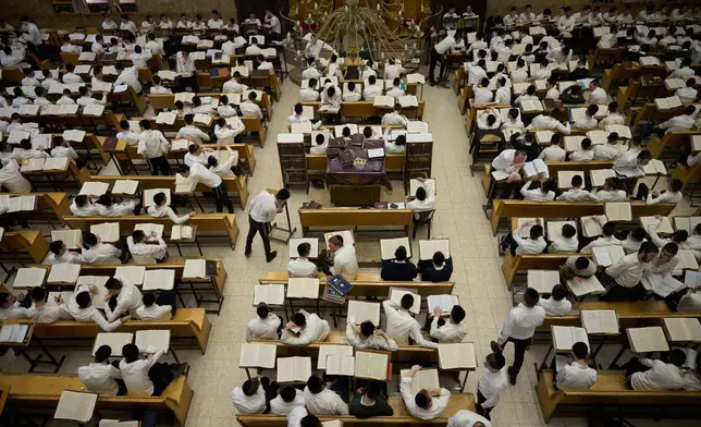 Ultra-Orthodox Jewish seminary students read and discuss Torah texts at Ponevezh, Israel’s most prominent yeshiva, or seminary, in Bnei Brak, Israel, Monday, Jan. 26, 2026. (AP Photo/Ohad Zwigenberg)