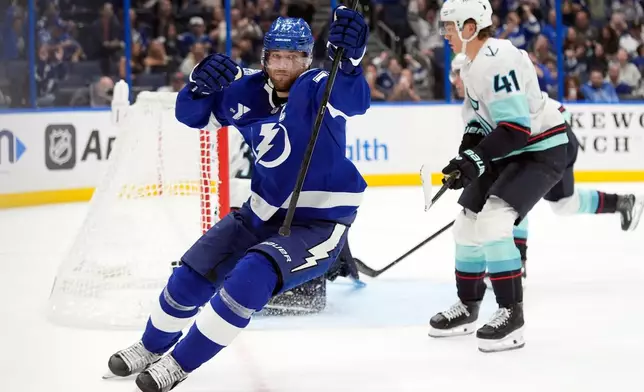 Tampa Bay Lightning defenseman Victor Hedman (77) celebrates his overrime goal against the Seattle Kraken during an NHL hockey game Thursday, Oct. 15, 2026, in Tampa, Fla. (AP Photo/Chris O'Meara)