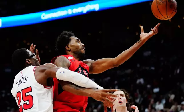 Chicago Bulls' Jalen Smith (25) fouls Toronto Raptors' Kawhi Leonard (2) during the second half of an NBA basketball game in Toronto, Wednesday, Oct. 21, 2026. (Frank Gunn/The Canadian Press via AP)