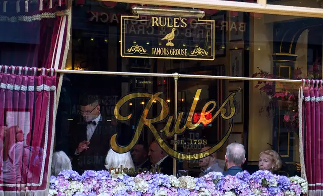 View at the window of Britain's oldest Restaurant ' Rules' which has been donated to Europe's biggest conservation charity in London, Wednesday, Oct. 14, 2026.(AP Photo/Alberto Pezzali)