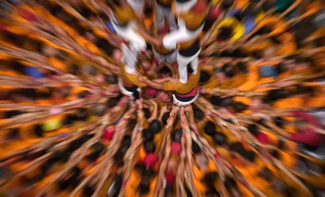 Members of Castellers Sagals d'Osona form a "castell" human tower during the 30th Concurs de Castells, or Human Tower Competition, in Tarragona, Spain, Saturday, Oct. 5, 2026. (AP Photo/Emilio Morenatti)