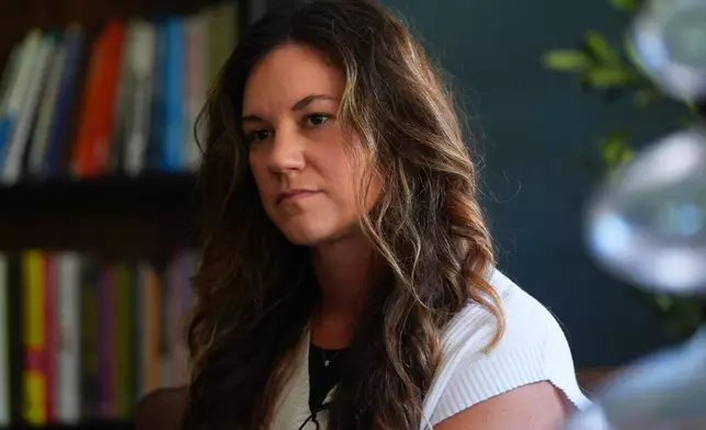 Parent Gwen Albaugh pauses during an interview at Covenant Christian Academy in Colleyville, Texas, Tuesday, Aug. 11, 2026. (AP Photo/LM Otero)