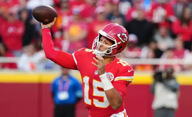 Kansas City Chiefs quarterback Patrick Mahomes (15) throws a pass during the second half of an NFL football game against the Los Angeles Chargers in Kansas City, Mo., Sunday, Oct. 18, 2026. (AP Photo/Ed Zurga)