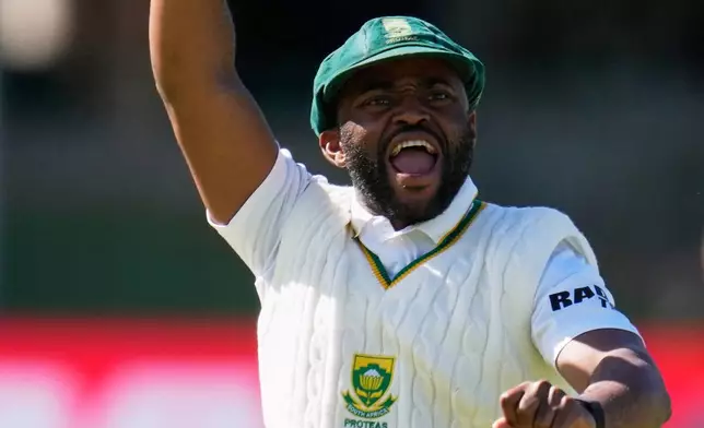 South Africa's captain Temba Bavuma celebrates as teammate Wiaan Mulder bowled out Australia's Scott Boland on day five of the second cricket test match between South Africa and Australia, in Gqeberha, South Africa, Thursday, Oct. 22, 2026. (AP Photo/Themba Hadebe)