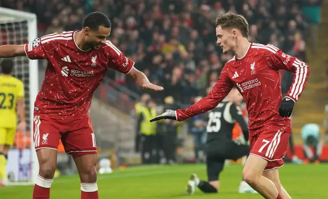 Liverpool's Florian Wirtz, right, celebrates with Liverpool's Cody Gakpo after scoring his side's fourth goal during the Champions League opening phase soccer match between Liverpool and Villarreal in Liverpool, England, Tuesday, Oct. 20, 2026. (AP Photo/Ian Hodgson)