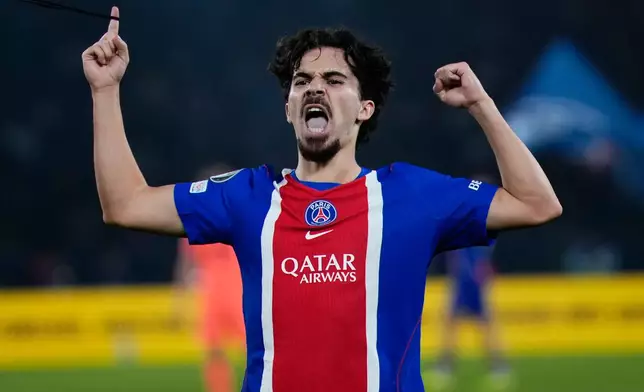 PSG's Vitinha celebrates after scoring his side's third goal during the Champions League opening phase soccer match between Paris Saint-Germain and FC Barcelona in Paris, Tuesday, Oct. 20, 2026. (AP Photo/Teresa Suarez)