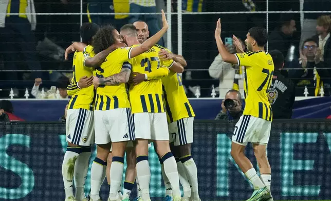 Fenerbahce players celebrate after their teammate Mason Greenwood scores the second goal against Slavia Praha during the Champions League opening phase soccer match between Fenerbahce and Slavia Praha in Istanbul, Turkey, Tuesday, Oct. 20, 2026. (AP Photo/Emrah Gurel)