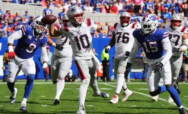 New England Patriots quarterback Drake Maye (10) passes against the Buffalo Bills in the second half during an NFL football game in Orchard Park, N.Y., Sunday, Oct. 4, 2026. (AP Photo/Jeffrey T. Barnes)