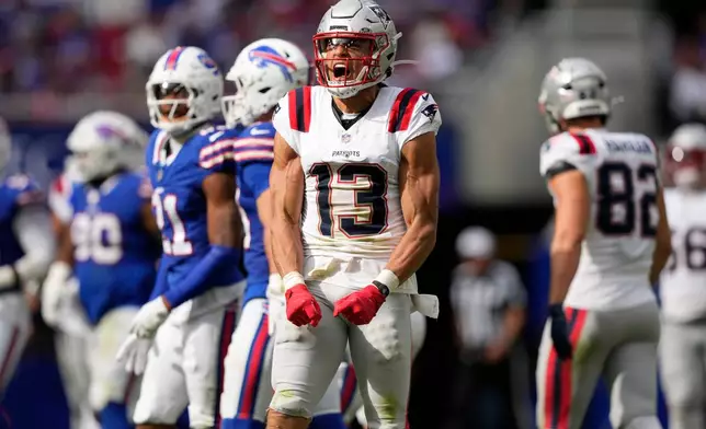 New England Patriots wide receiver Mack Hollins (13) reacts in the second half against the Buffalo Bills during an NFL football game in Orchard Park, N.Y., Sunday, Oct. 4, 2026. (AP Photo/Carolyn Kaster)