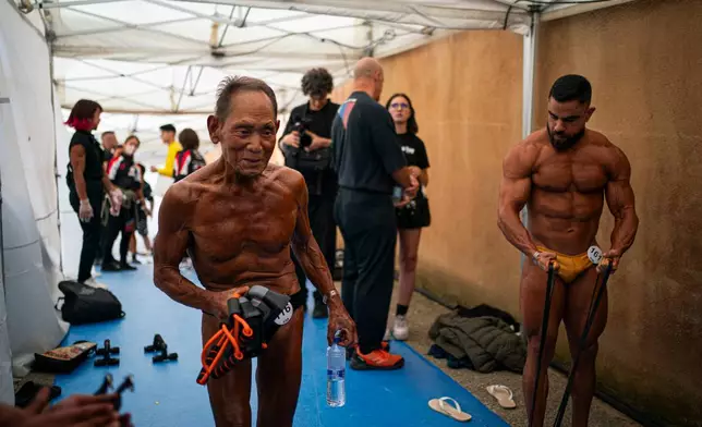 Japanese bodybuilder Toshisuke Kanazawa, 90, prepares to compete in the 2026 IFBB World Fitness and Bodybuilding Championships in Santa Susanna, Spain, Friday, Oct. 30, 2026. (AP Photo/Pau Venteo)
